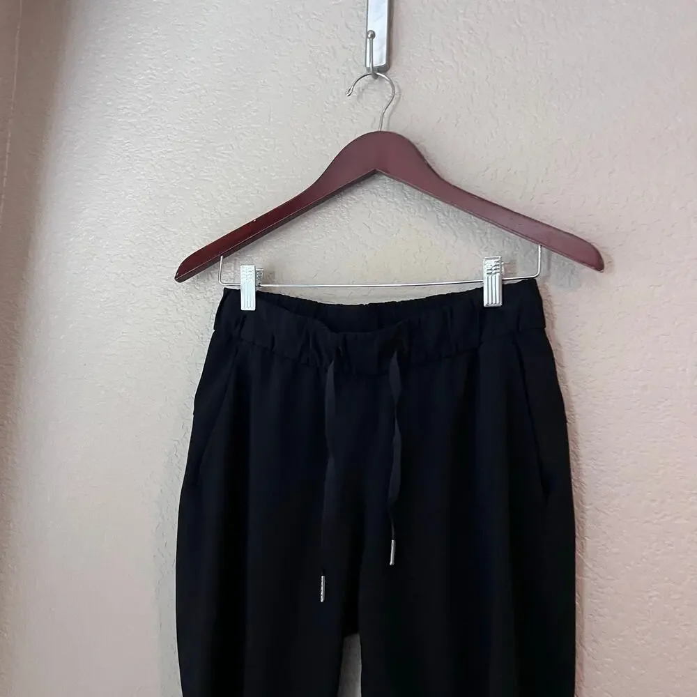 Lululemon On The Fly Black Pants Size 4 Women’s Elastic Waist Side Pockets - Picture 5 of 7